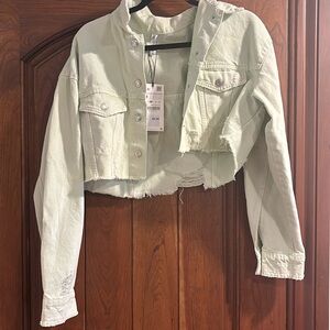 Green distressed denim jacket